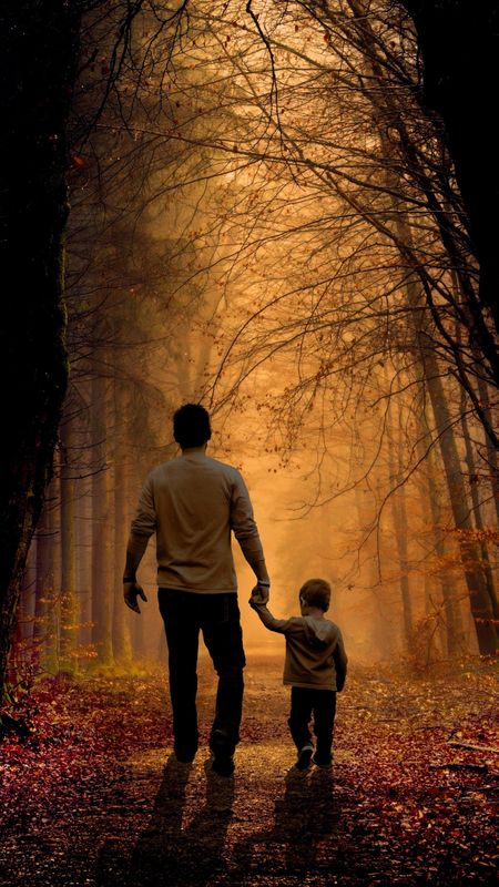 father and son walking in the jungle Wallpaper